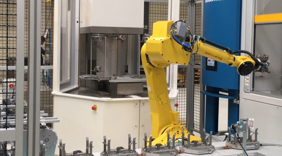 Industrial parts cleaning in robotic cell